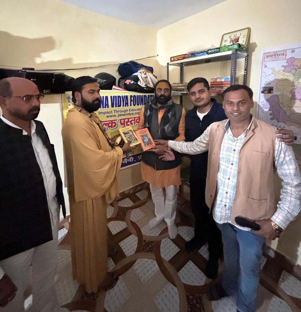 Jana Vidya Foundation team setting up free library with books in Prayagraj village